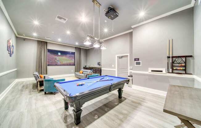 a games room with a pool table and ping pong table at Meridian Obici, Suffolk, 23434