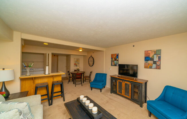 Living Room with Kitchen Access at West Hampton Park Apartment Homes, Elkhorn, Nebraska