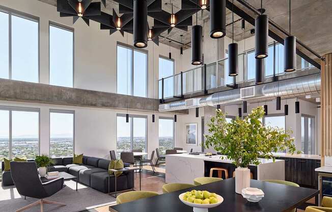 A modern dining room with a table set for two and a view of the city.