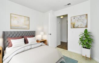 a bedroom with a bed in a room