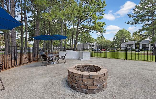 the reserve at bucklin hill leasing office patio with fire pit and umbrellas