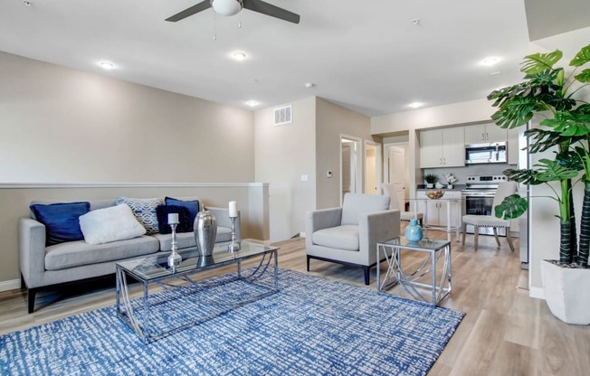 a living room with a couch and two chairs