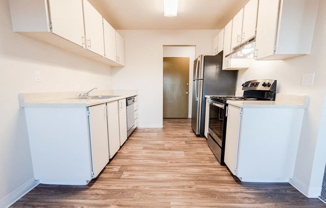 Lakewood Apartments - Arbor Pointe Apartments - Kitchen and Entryway, from Dining Room