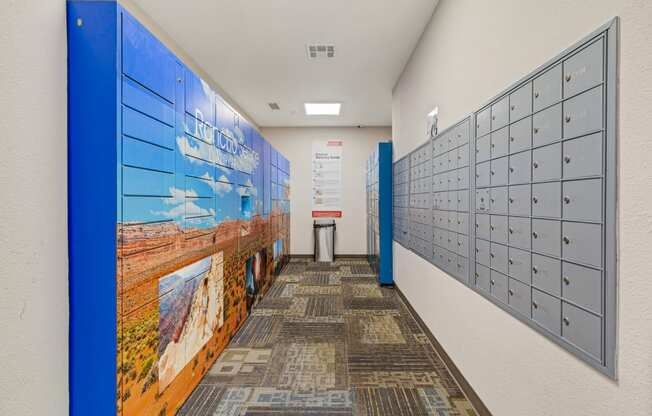 a hallway with lockers and a mural on the wall
