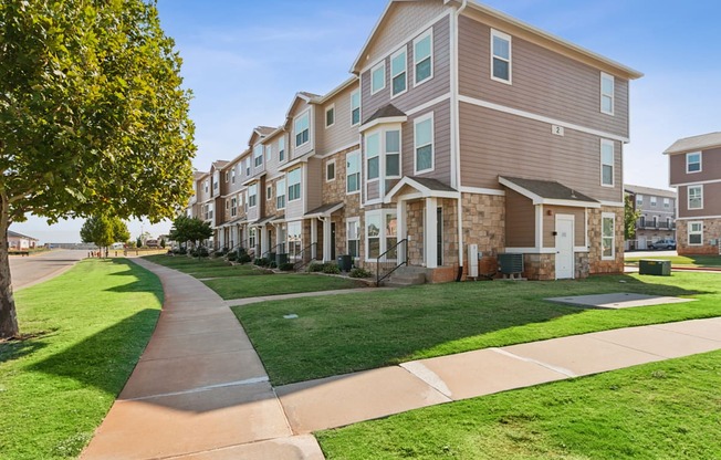 A long building with a walkway in front of it.