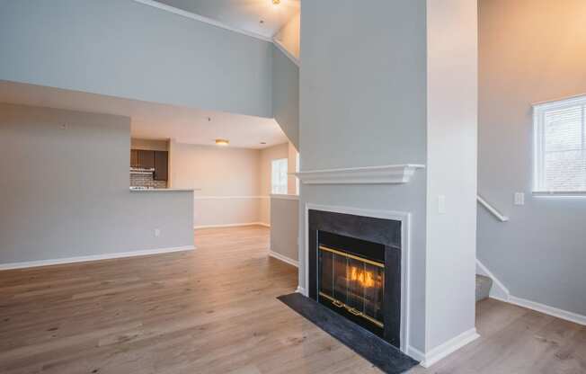 the living room has a fireplace and a hardwood floor