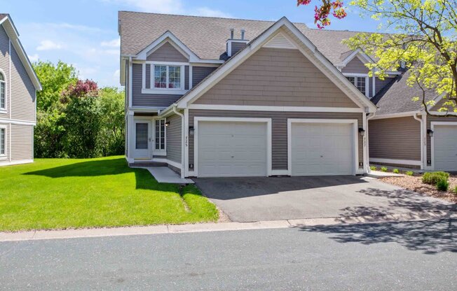 a house with a driveway and a garage door