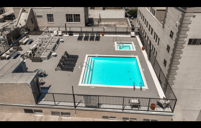 an aerial view of a swimming pool on the roof of a building