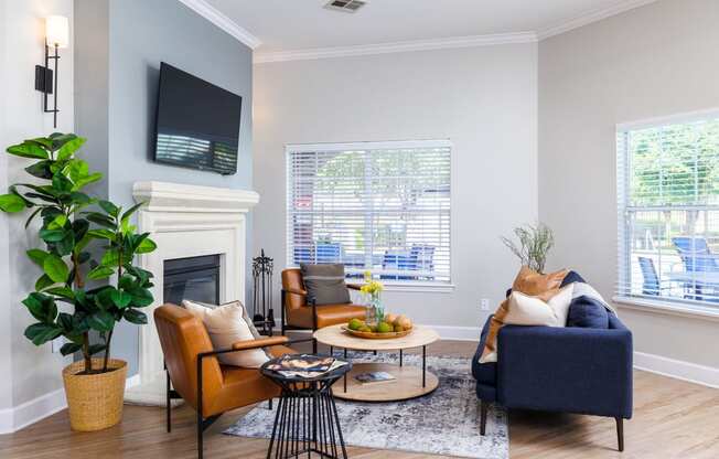 a living room with gray walls and a fireplace with a tv above it