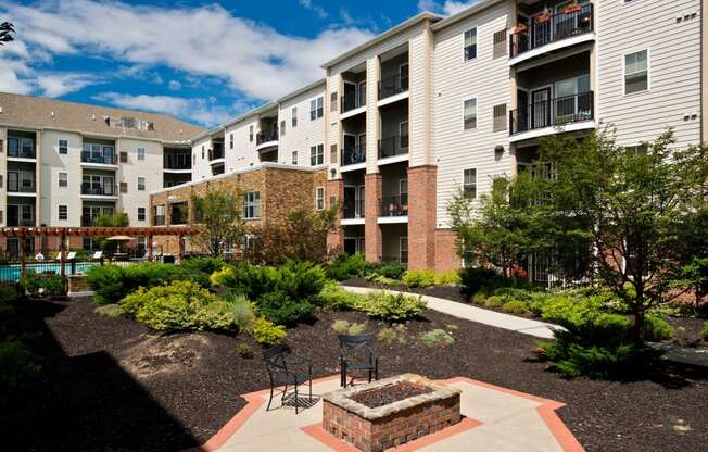 Outdoor courtyards with gas grills and fire pits at Alexander at Patroon Creek, Albany, New York