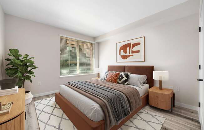 a bedroom with a large bed in a 555 waverly unit