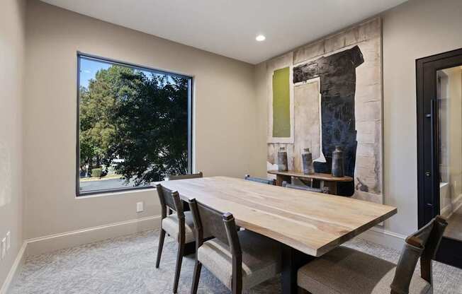 Flatiron West Trade Apartments business center with custom wood meeting table