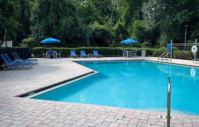 Experience relaxation at its finest in this serene outdoor pool area.