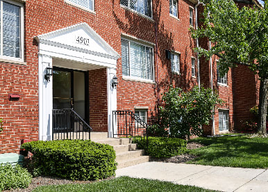 exterior of brick apartment building at cambridge square apartments in bethesda md