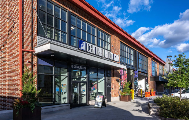 the front of a brick building with a sign that reads central market