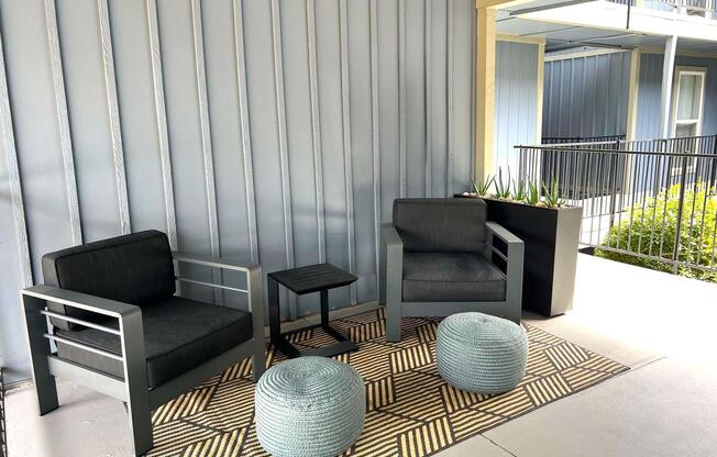 a living room filled with furniture and a large window