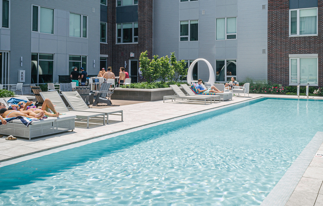 Quarter residents enjoy a heated zero-edge pool with cabanas and grills on a raised deck