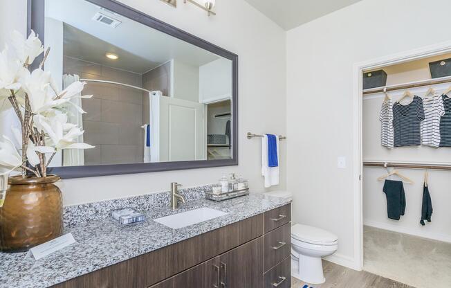 a kitchen with a sink and a mirror