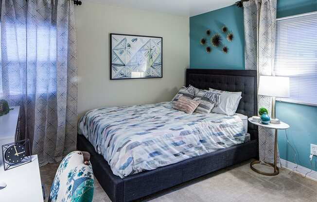 Bedroom With Expansive Windows at Heritage Apartments, Ohio