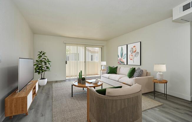 a living room filled with furniture and a flat screen tv