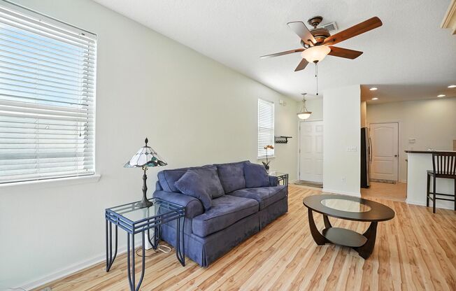 Immaculate three-bedroom, three-bath end-unit townhome showcasing upgrades throughout.