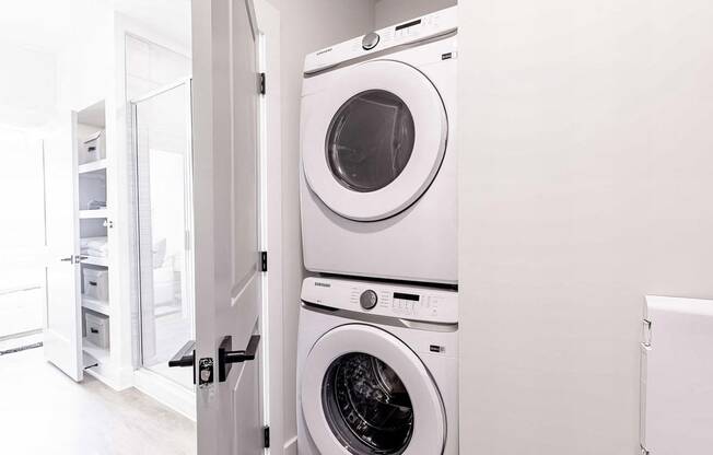 Modern bathroom with convenient in-unit washer and dryer at Novel Cary