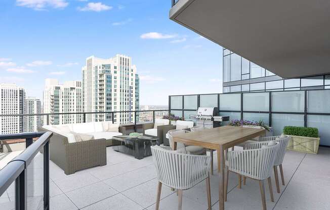 a rooftop terrace with a table and chairs and a view of the city at Cassidy on Canal, Chicago, Illinois, 60606