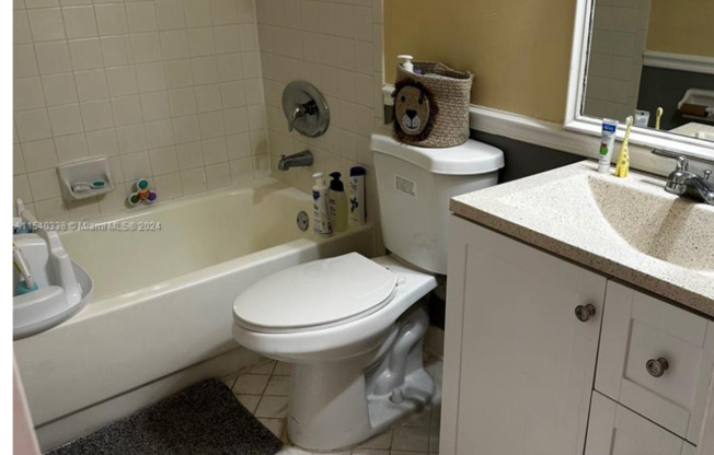 2-bedroom, 2-bathroom condo in a well-maintained gated community, featuring a spectacular direct lake view