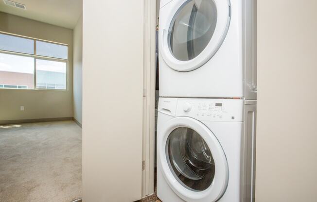 a front loading washer and dryer in a laundry room