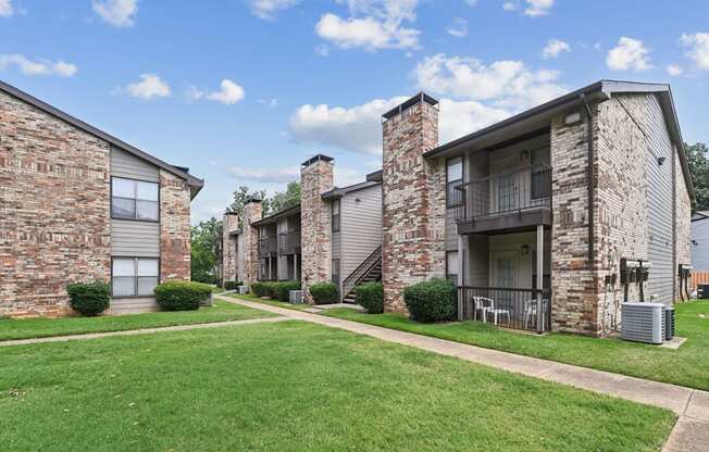 Apartment exteriors at Brighton Place in Lewisville, TX