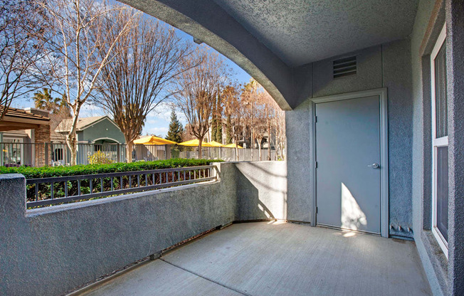 the entrance to a condo building with a blue door