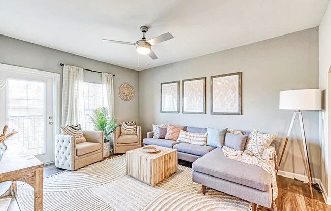 a living room with furniture and a ceiling fan at the flats at sundown luxury apartments in north port florida