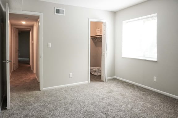 Bedroom with attached closet at The Life at Legacy Fountains, Missouri