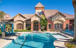 a house with a swimming pool in front of it