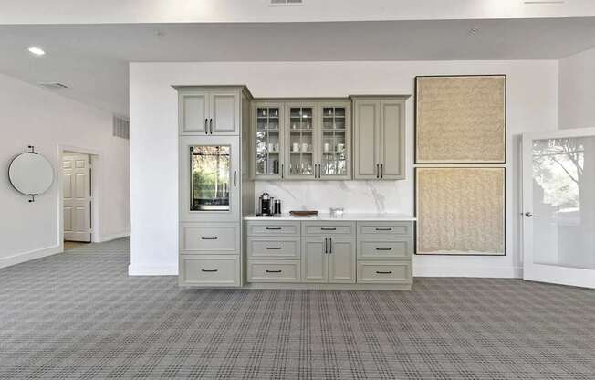 A kitchen with a sink, cabinets, and a window at Prairie Crossing, Farmers Branch, TX