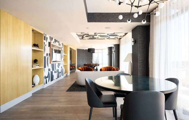 a dining room and living room with a table and chairs