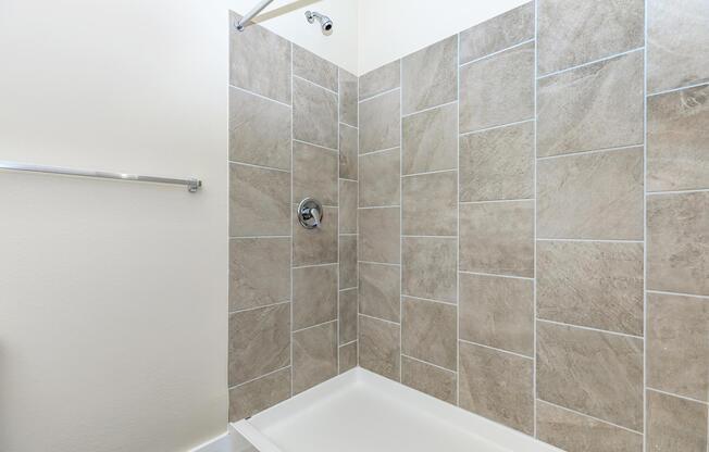 Apartments in Leander TX - Hills at Leander Expansive Bathroom with a Large Vanity, Shower, and Much More