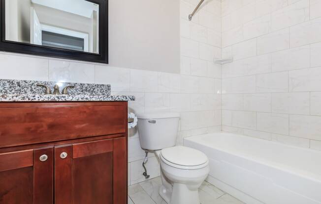 a bathroom with a sink toilet and bathtub