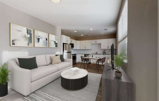 A modern living room with a white couch and a grey rug.