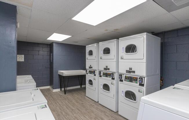 a refrigerator freezer sitting inside of a building