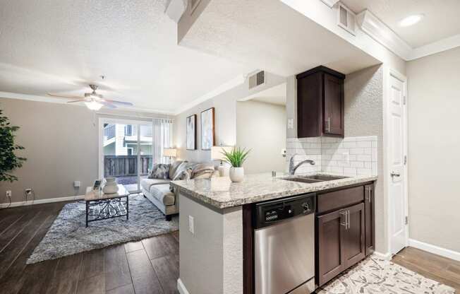 an open floor plan with a kitchen and living room