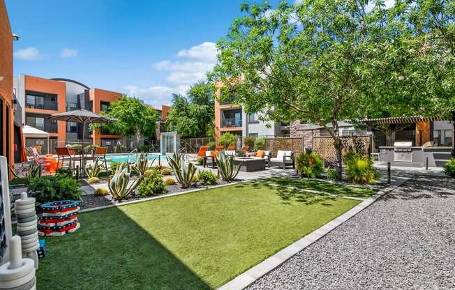 Outdoor Game Area at Harmony at Surprise Apartments in Surprise, AZ.