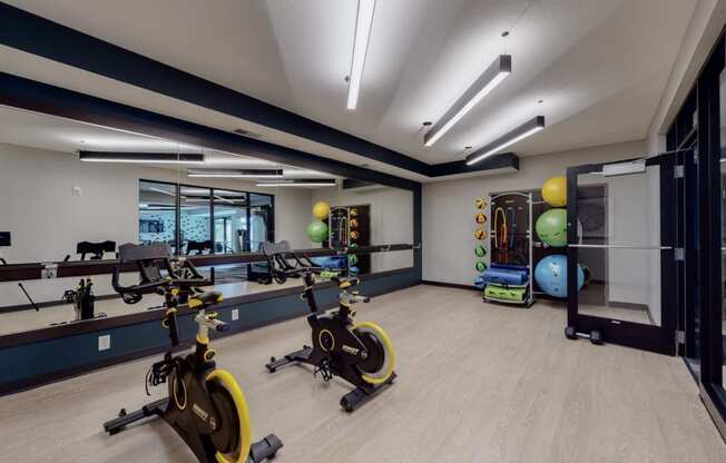 a gym with exercise equipment and weights