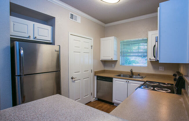 Full Kitchen with Dishwasher and Microwave at Suisun City Apartments