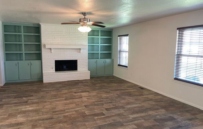 3 bed 2 bath with covered patio, wood ceramic flooring, new paint all updated with a fenced yard in Moore Schools!