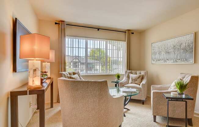 Living room with large window at the villages at general grant apartments