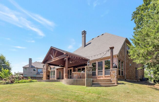 Grand Flower Mound home on heavily treed lot