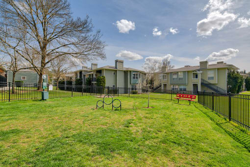 Newly Renovated Apartments in Lake Oswego OR-Kruseway Commons Gated Off-Leash Dog Park with Grass, Benches, and Doggie Bags