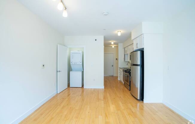 A kitchen with a refrigerator, oven, and sink. at 603 Concord Apartments, Cambridge, MA