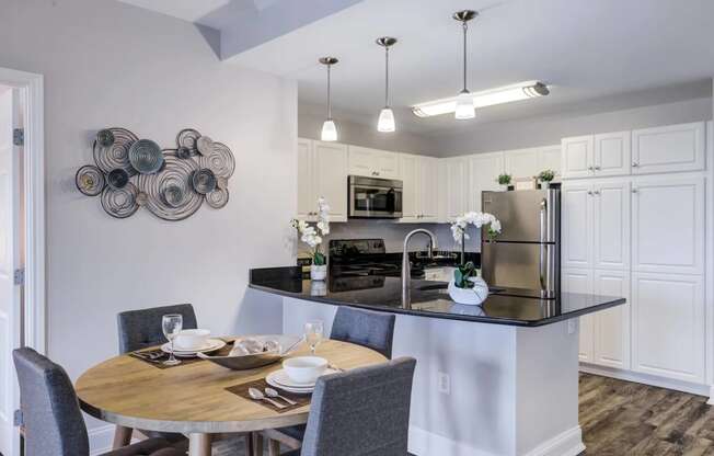 Dining Table with Kitchen Area in background